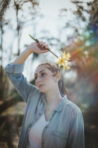 girl with spring flowers at senior portrait session at hilton head