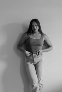 the photographer is posing near the wall