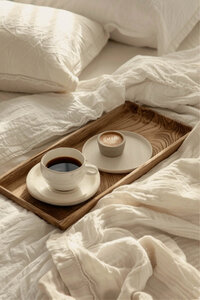 Room service breakfast coffee on a cozy, inviting hotel bed. Tailored Oasis Travel Co.