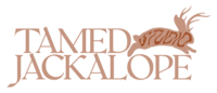 Tamed Jackalope Studio pink logo for showit website design and squarespace website design