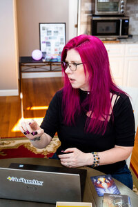 Barb Pritchard explaining brand  strategies  with her laptop in front of her.