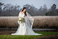 bridal portrait in front of the water at Caledonia
