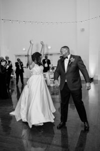 Newlyweds dancing together during their wedding reception