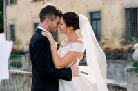 Beautiful bride looking in the mirror