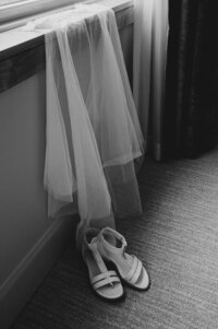 a wedding veil and bridal shoes