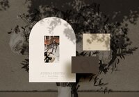 Flat lay of Athena Kristen wedding planner brand identity suite, featuring logo, business cards, and arched invitation design, styled with florals and soft shadow play for an elegant, editorial look.