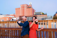 A couple dancing while standing on a rooftop