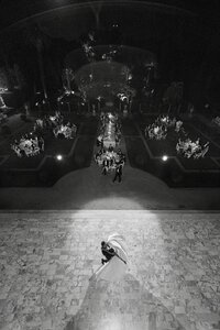 Aerial image of husband and wife twirling on the dance floor