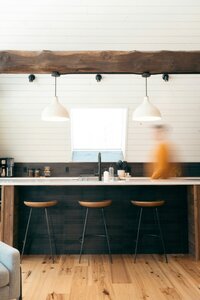 A photo of a home living room that is dark and moody.