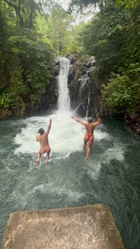 Jessie and a friend jumping in a waterfall