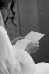 Bride reading letter from groom Southern California wedding photographer moment