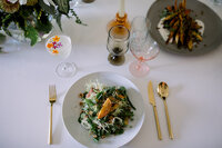 Chef-prepared seasonal salad on a wedding dinner table