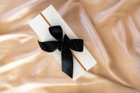 white box with black bow