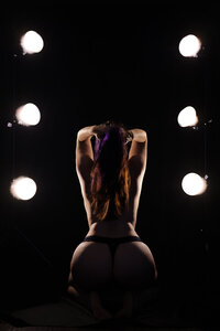 spot lights topless woman