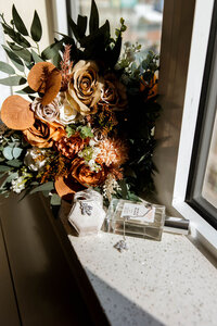 Shaded bouquet sitting in a windowsill