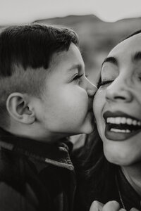 Son kissing his mom during photo session in Sammamish, WA
