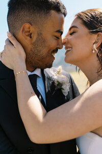 couple embracing and smiling at each other