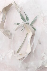 White heels and wedding veil detail photo