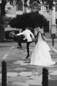 An ecstatic groom jumps for joy after marrying the love of his life.