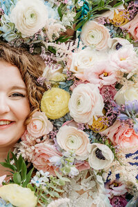 Bride surrounded by flowers