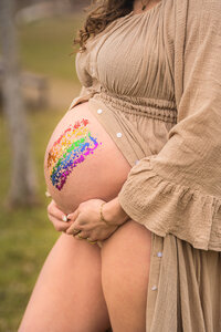 newborn baby in moms arms looking at camera in strongsville ohio