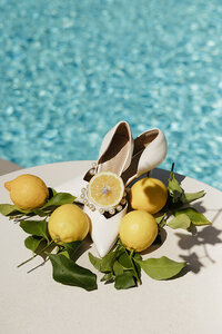 Bridal details featuring wedding rings, heels and lemons in Amalfi Coast, Italy