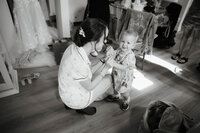 bride and daughter on wedding day getting ready photos for wedding candid and natural style wedding photography