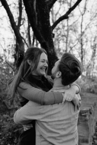 romantic photo of a couple spinning around and laughing in arkansas