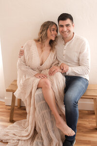 Couple sitting together in a Reno studio.