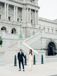 couple in front of venue holding hands, taken by baltimore wedding photographer Nicole Simensky