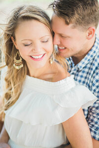Stunning couple snuggled up and smiling at each other at Ringling Museum Venue Sarasota, FL 