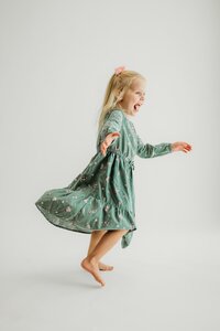 little girl dancing around a photography studio
