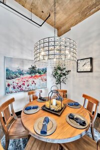Dining table with seating for 6  in this 3-bedroom, 2-bathroom luxury condo in downtown Waco, TX