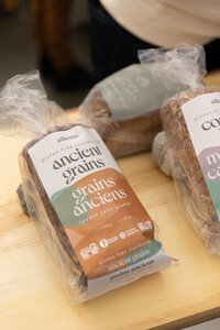 Product display of Alkeme gluten-free sourdough at the Gluten Free Expo, showcasing branding and market readiness.