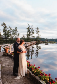 photo of bride and groom at sunset on their wedding day at white pine camp in the adirondacks