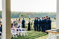 Bride reciting vows to groom during their wedding ceremony at Allenbrooke Farms in Spring Hill, Tennessee.