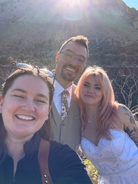 Desiree taking a selfie with an eloping couple.