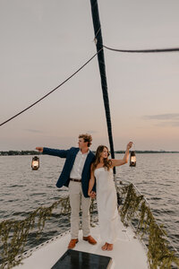 Coastal elopement with couple on a sailboat in Orange Beach