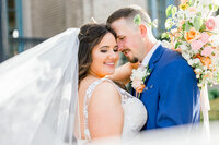 bride and groom veil shot