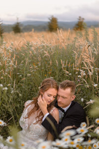 photo of bride and groom in a field after their small wedding in asheville