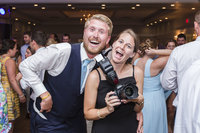 Wedding Photographer smiling with Groom