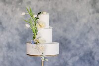 Three tier luxury wedding cake with fresh flowers