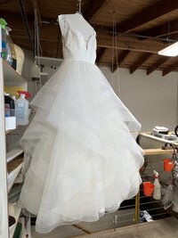 a bridal gown after being steamed and pressed