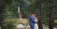 Yosemite Valley Chapel behind couple on sentinel beach