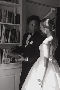 black and white wedding portrait in a library