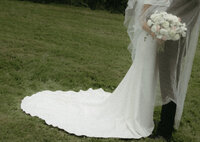 Intimate wedding portrait of a bride and groom sharing a quiet moment together in an outdoor setting