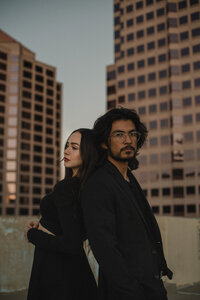 Couple posing on downtown albuquerque rooftop.
