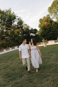 Couple running together after ceremony in black and white