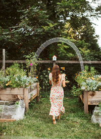 a bride walking through a garden