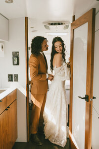 newlyweds stand in doorway